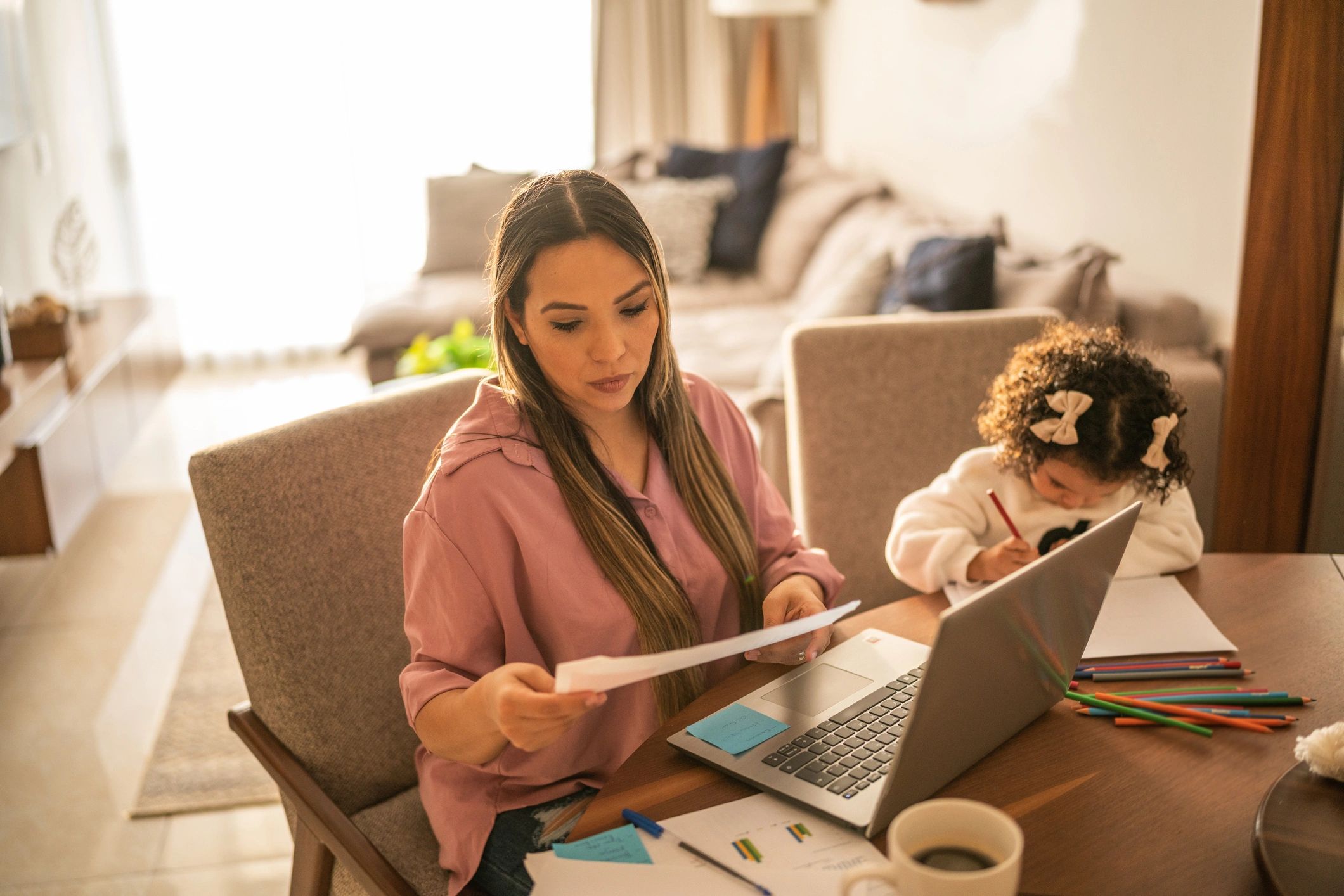 Person reviewing paperwork at home